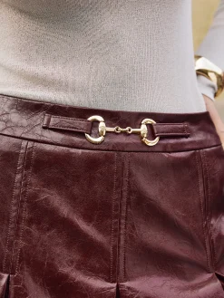 COMMENSE Skirts|Bottoms^Metal-Detail Pleated Faux Leather Skirt Burgundy